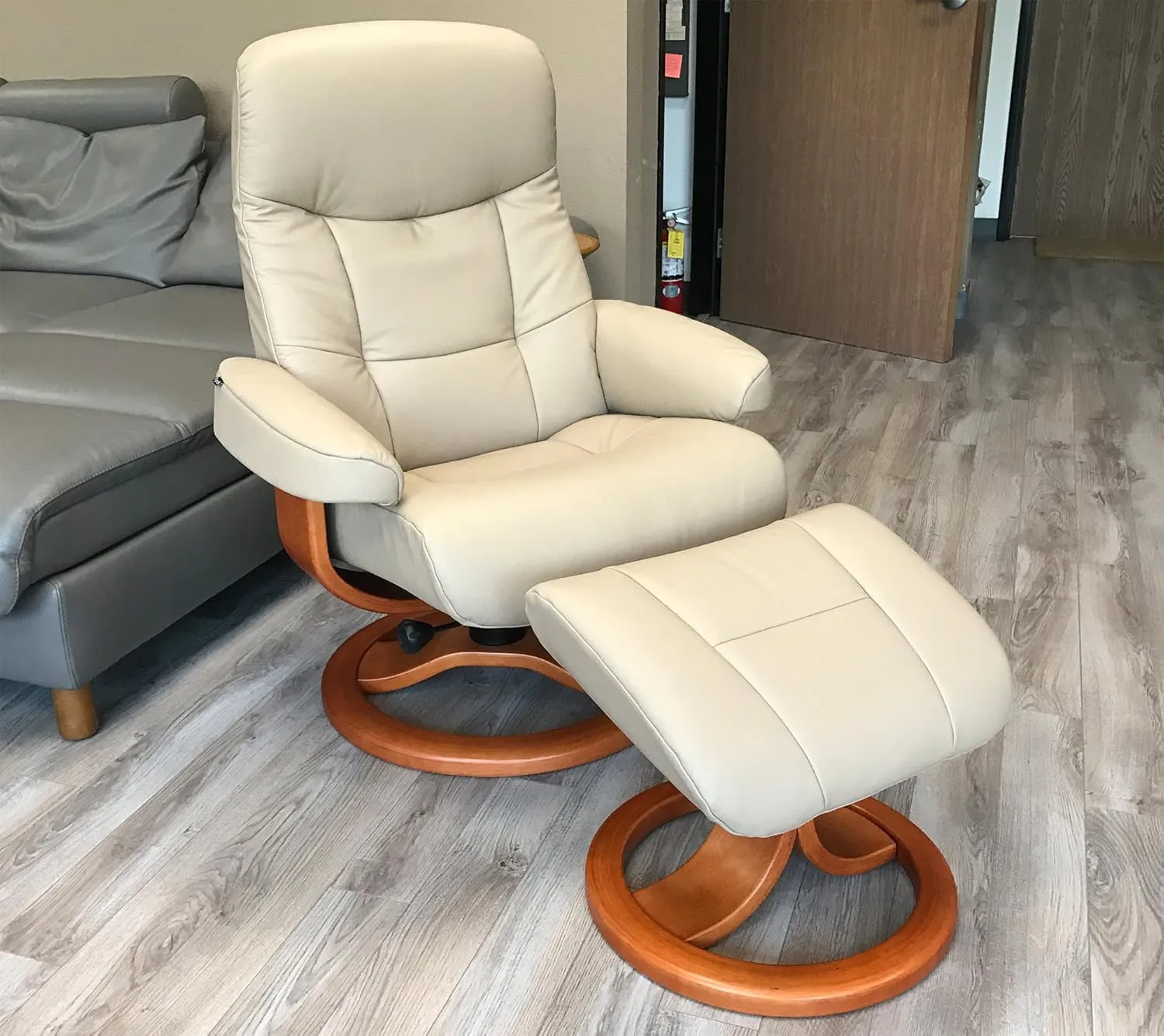 Large Leather Ergonomic Swivel Recliner Chair with Ottoman in Sandel NL 121 Nordic Line Leather with a Espresso Wood Stain Base