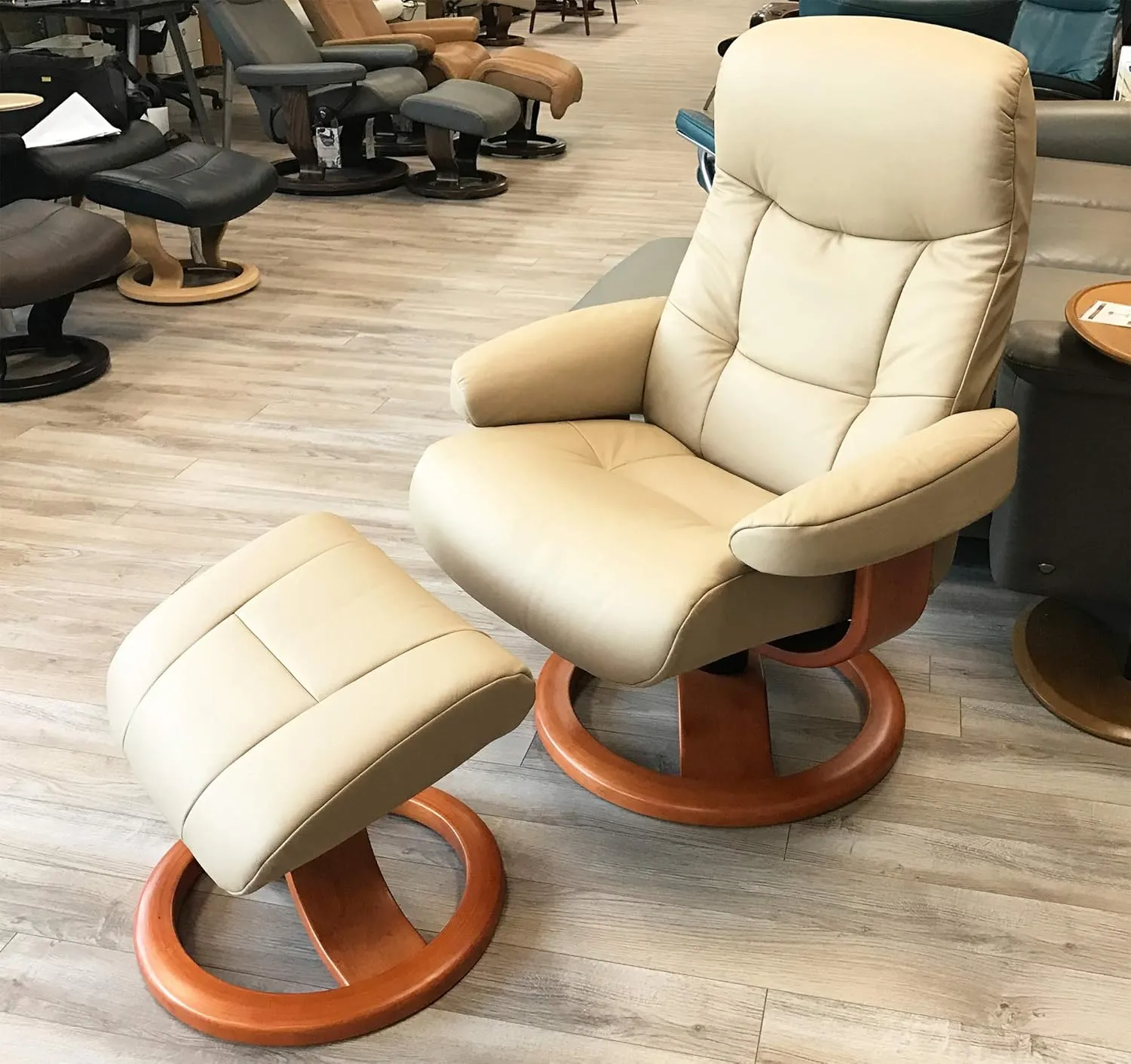 Large Leather Ergonomic Swivel Recliner Chair with Ottoman in Sandel NL 121 Nordic Line Leather with a Espresso Wood Stain Base